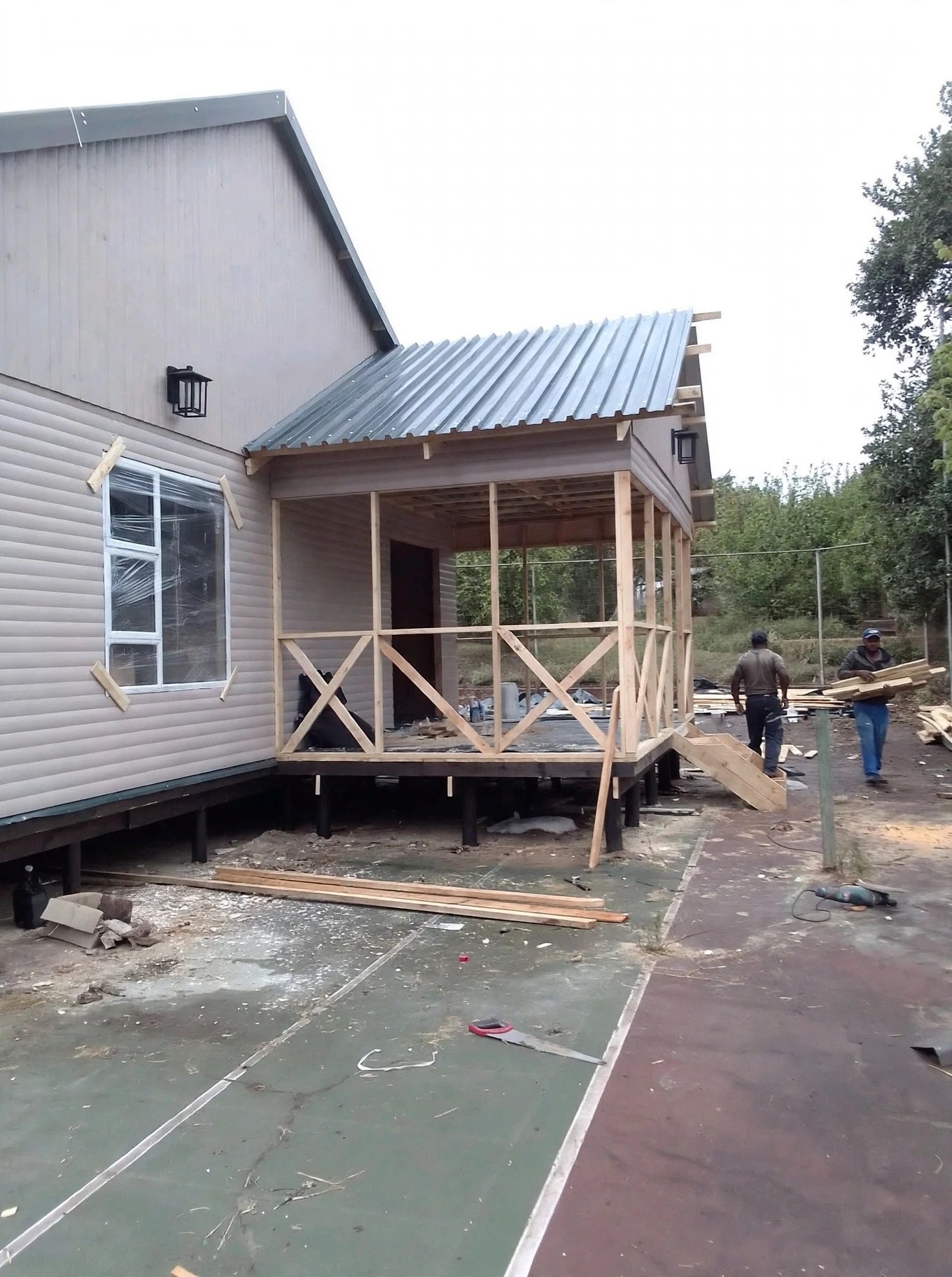 Light-grey home with covered timber entrance