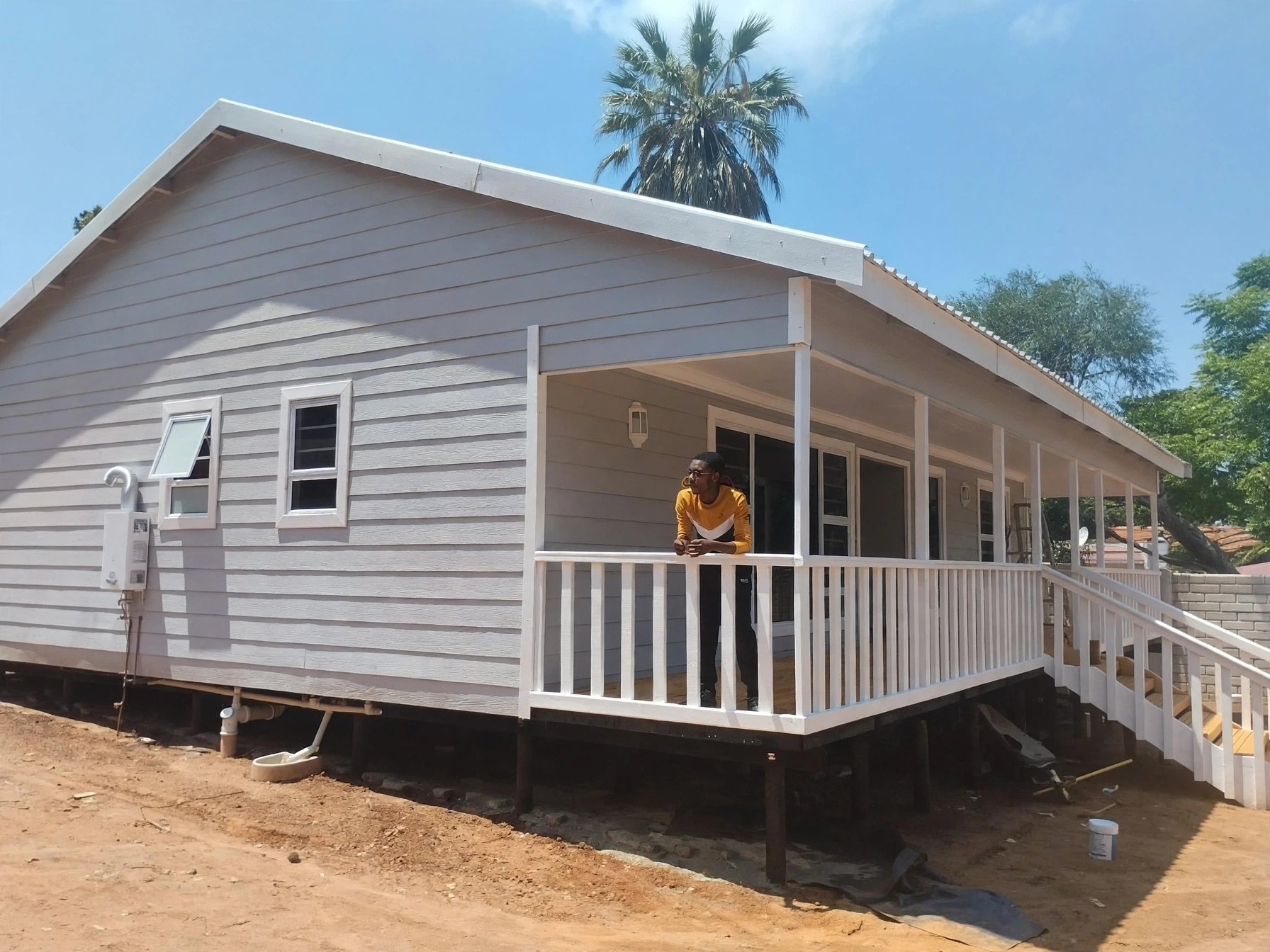Light-grey home with full-width covered veranda