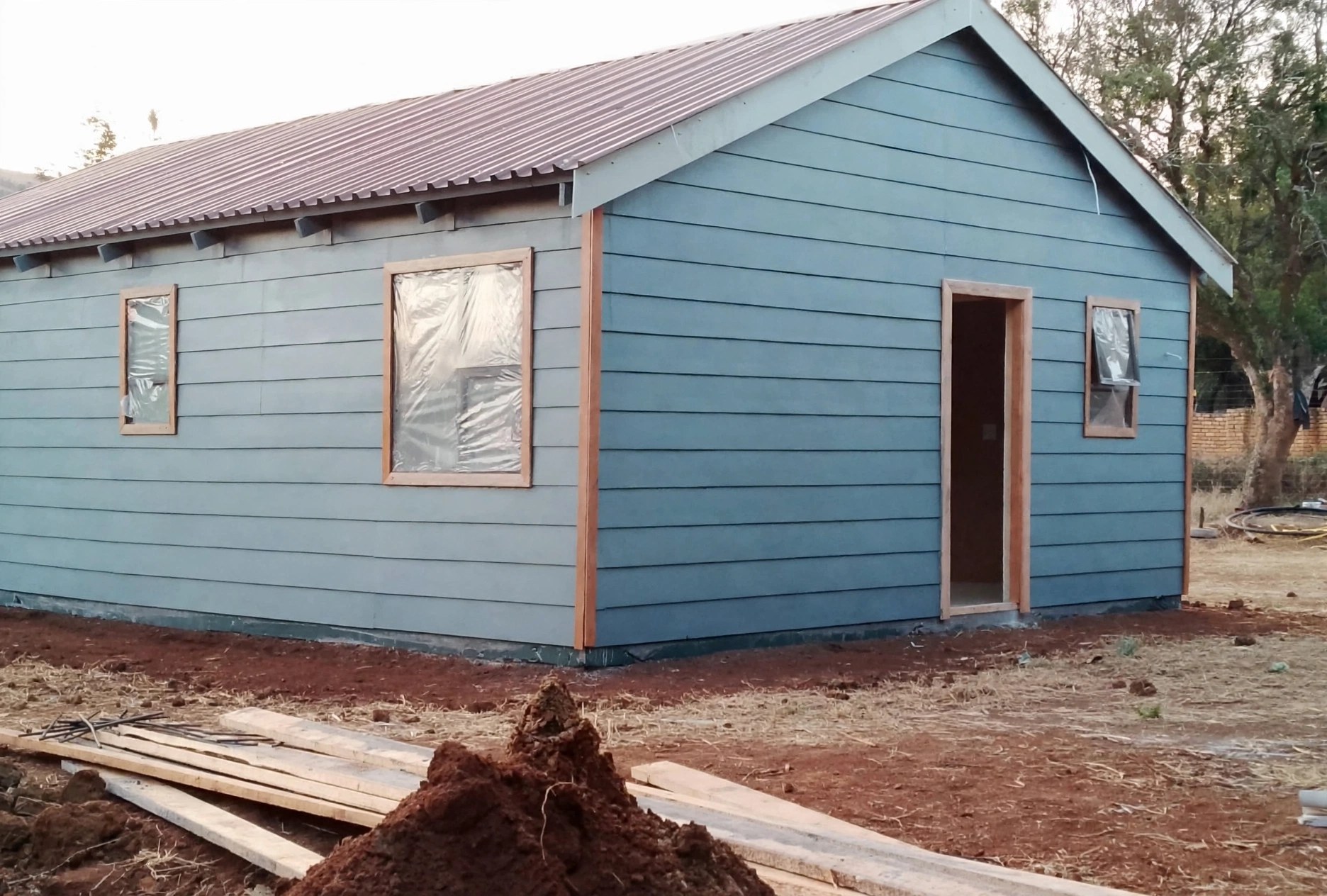 Blue clad building with open doorway