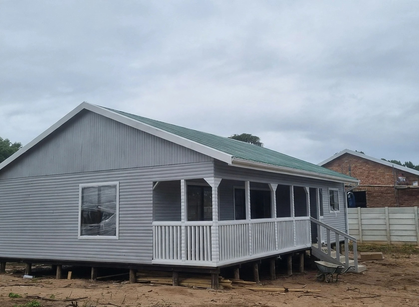 Grey home with full-length veranda
