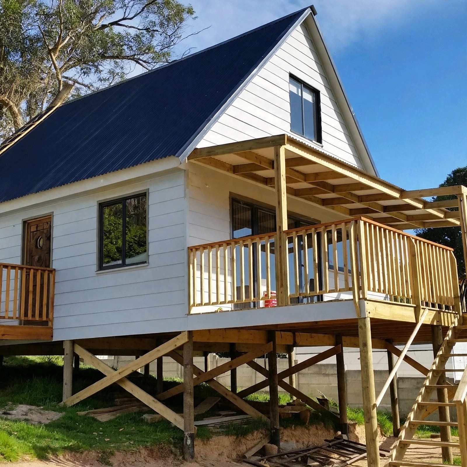 Gabled light-coloured home with timber veranda